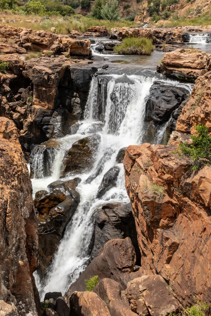 The Treur River falls between rocks at Bourke’s Luck Potholes
