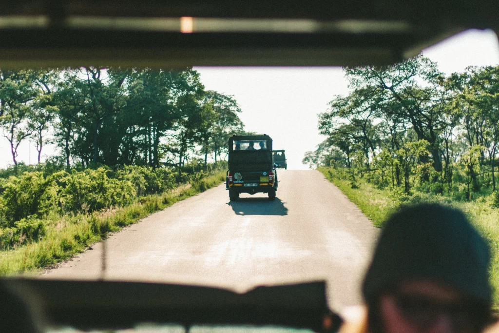 A vehicle ahead on a Kruger park road, seen from another vehicle